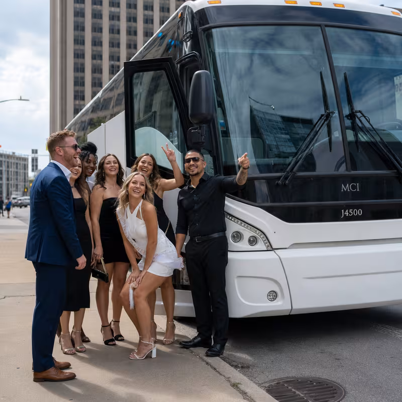 Passengers loading luggage while boarding an Oklahoma City group shuttle