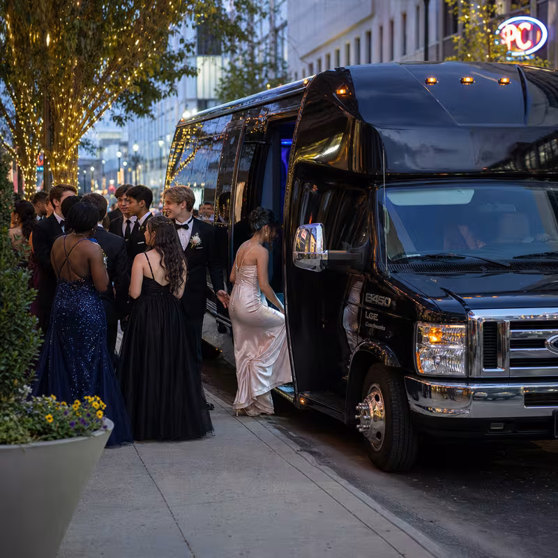 Passengers loading luggage while boarding an Oklahoma City group shuttle