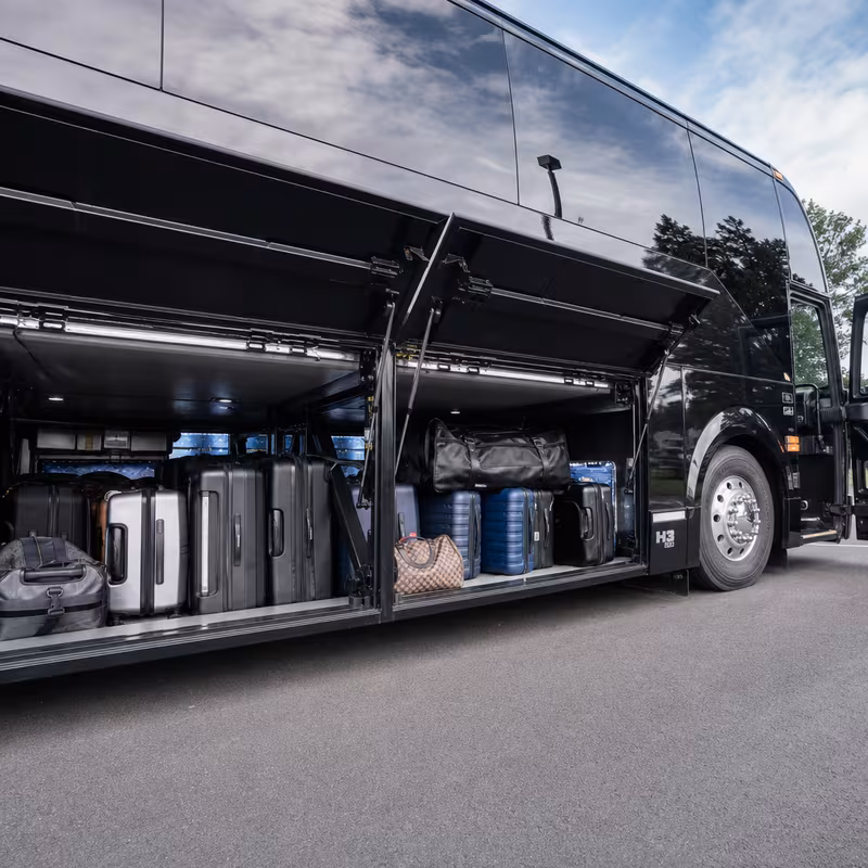 Party bus interior with wraparound leather seating and LED lighting in Oklahoma City