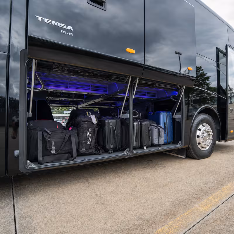 Party bus interior with wraparound leather seating and LED lighting in Oklahoma City