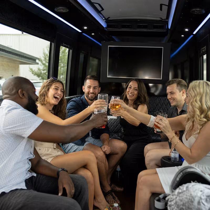Group boarding a white charter bus for Winery & Brewery Tour Transportation transportation in Oklahoma City